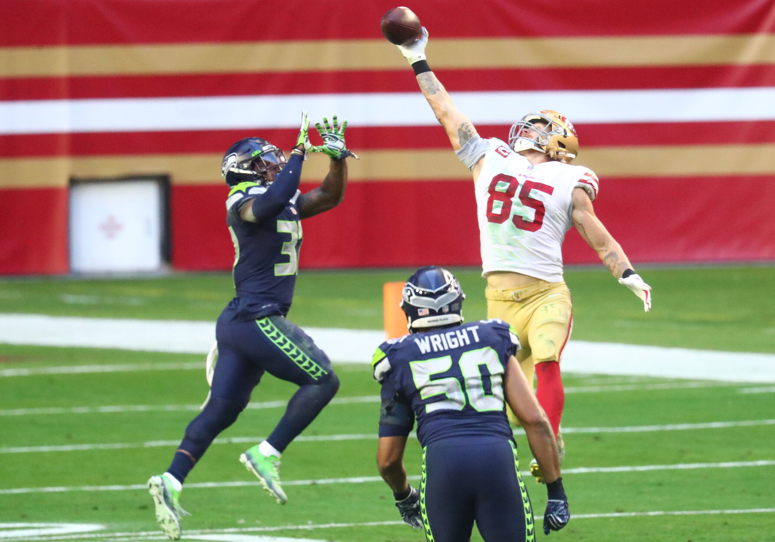 Jan 3, 2021; Glendale, Arizona, USA; San Francisco 49ers tight end George Kittle (85) makes a catch against Seattle Seahawks Seattle Seahawks free safety Quandre Diggs (37) during the second half at State Farm Stadium. Mandatory Credit: Mark J. Rebilas-USA TODAY Sports